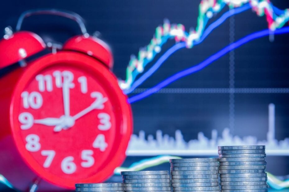 a stack of five rows of coins and an alarm clock scaled e1643283798494