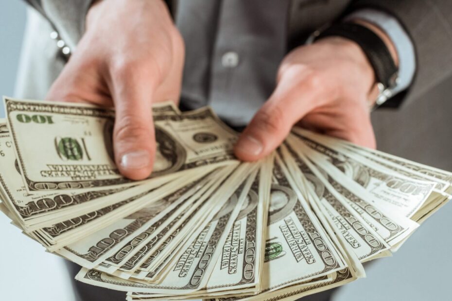 close up view of businessman holding dollar bankno 2021 08 29 19 47 20 utc scaled e1644188675593